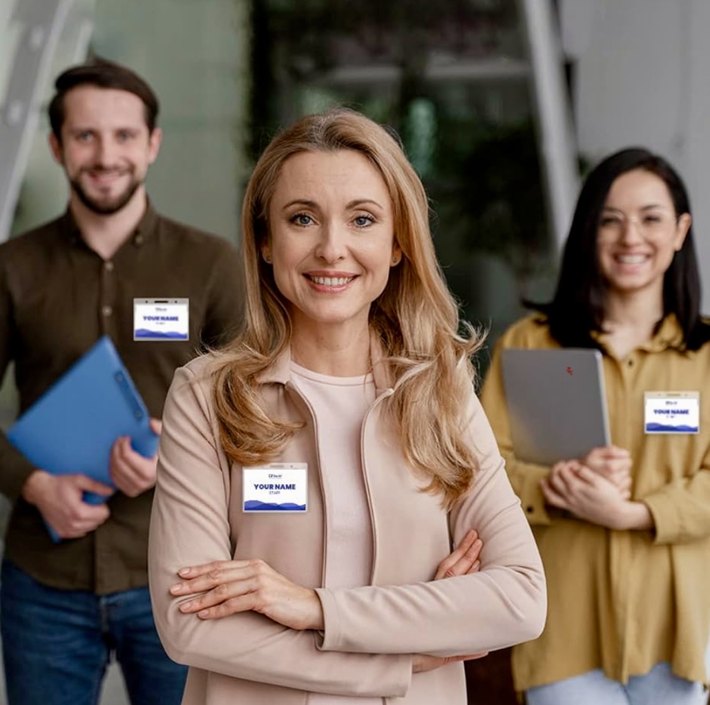 3 people wearing a name badge at a trade show